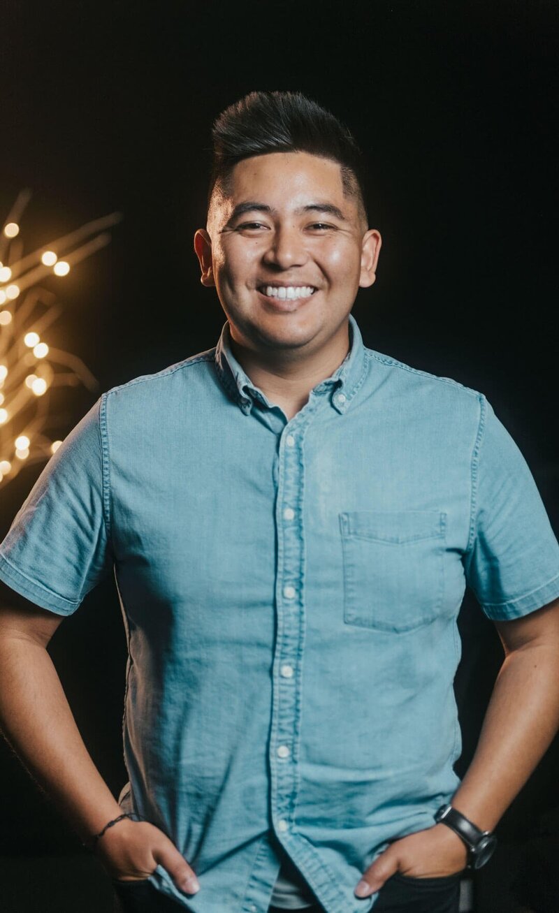 Professional wedding photographer and videographer in California smiling for the camera.