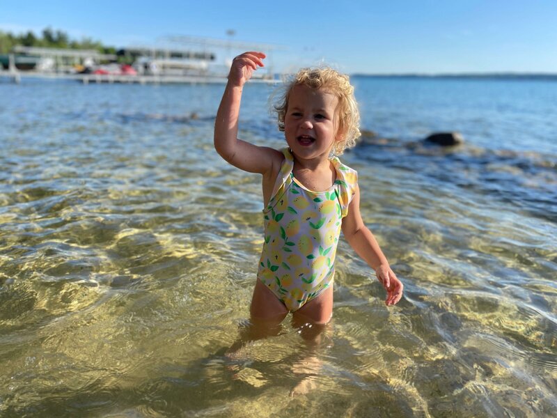 Alison and Jon's daughter playing in lake