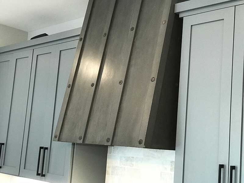 Concrete oven range hood with concrete rivets
