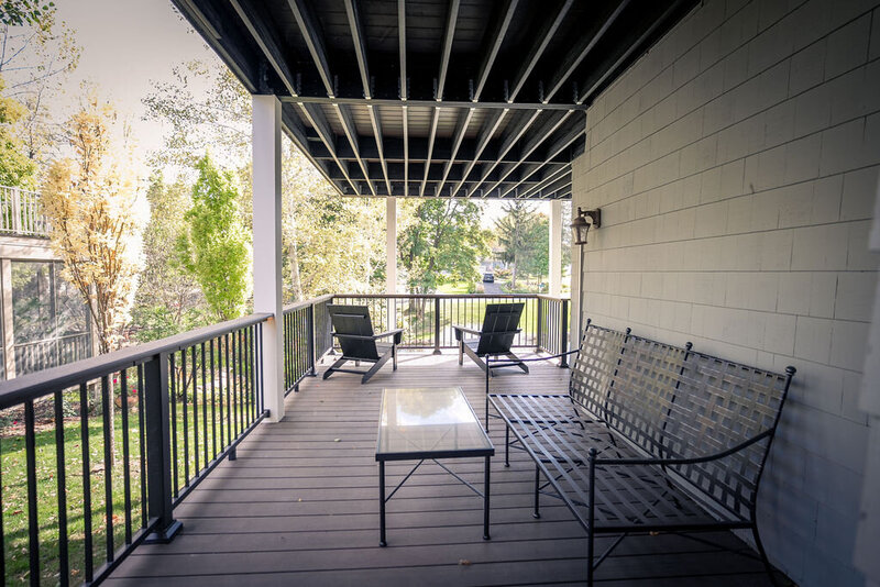View of lower private deck from the door to the kitchen. 
