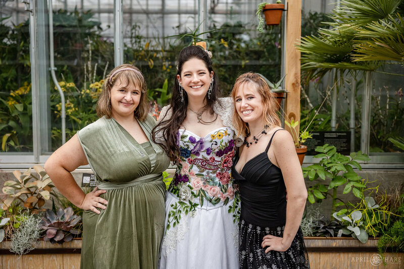 Bride with her best friends at the Orangery on her wedding day