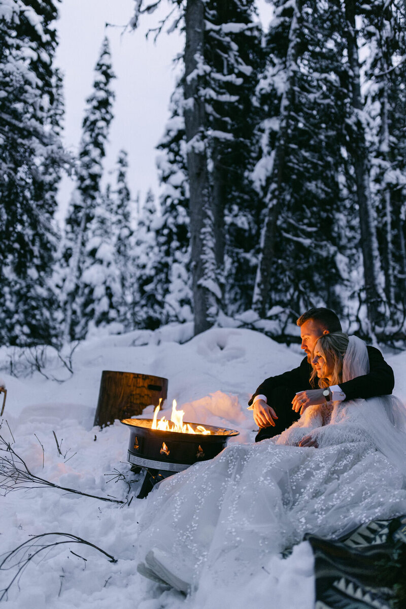 A breathtaking photograph of the mountains in Banff National Park, captured from the wooden bridge at Emerald Lake Lodge before the bride and groom entered their reception. A serene moment in a stunning natural setting.