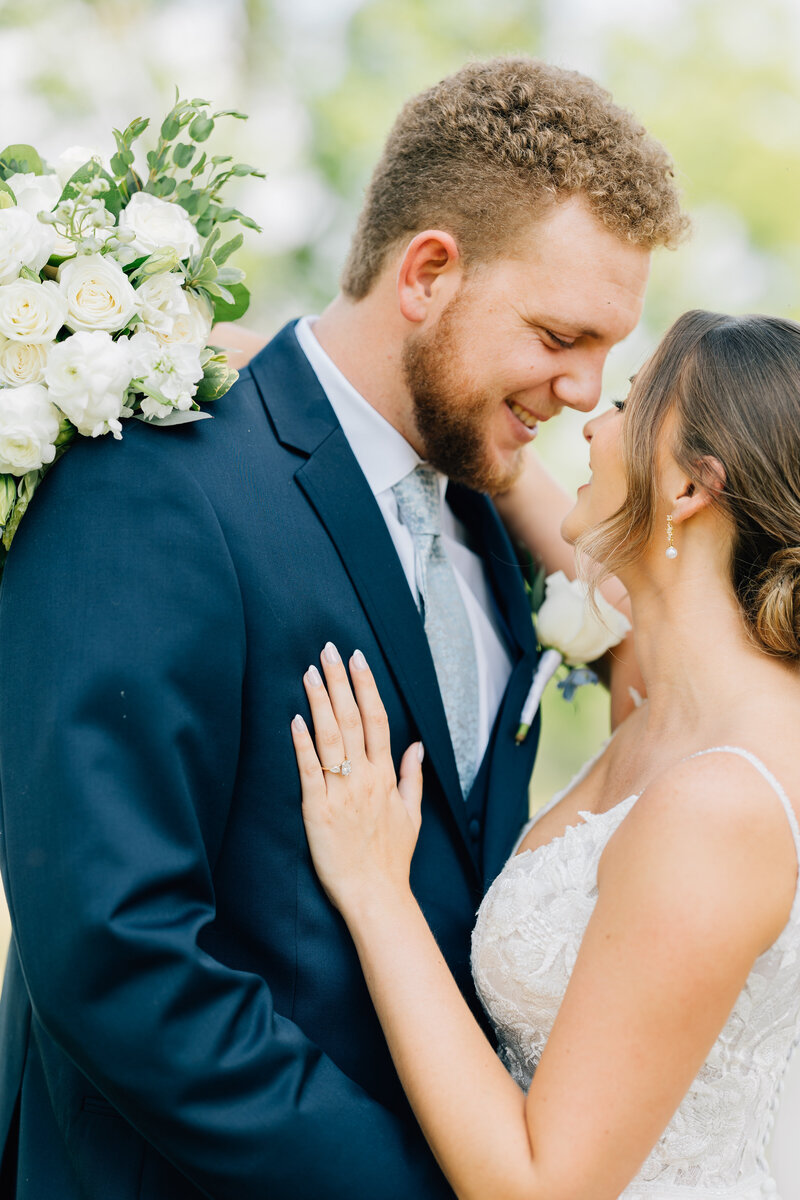 groom smiling at his bride
