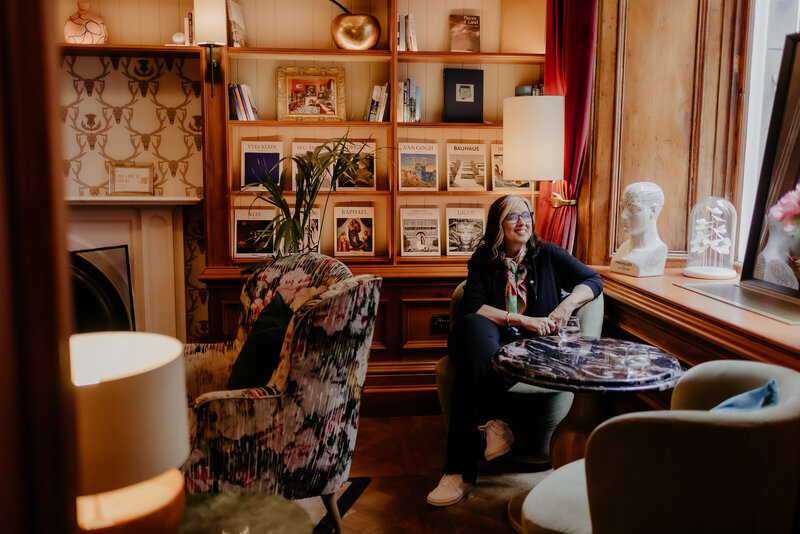 Margaret sitting in a library in Edinburgh