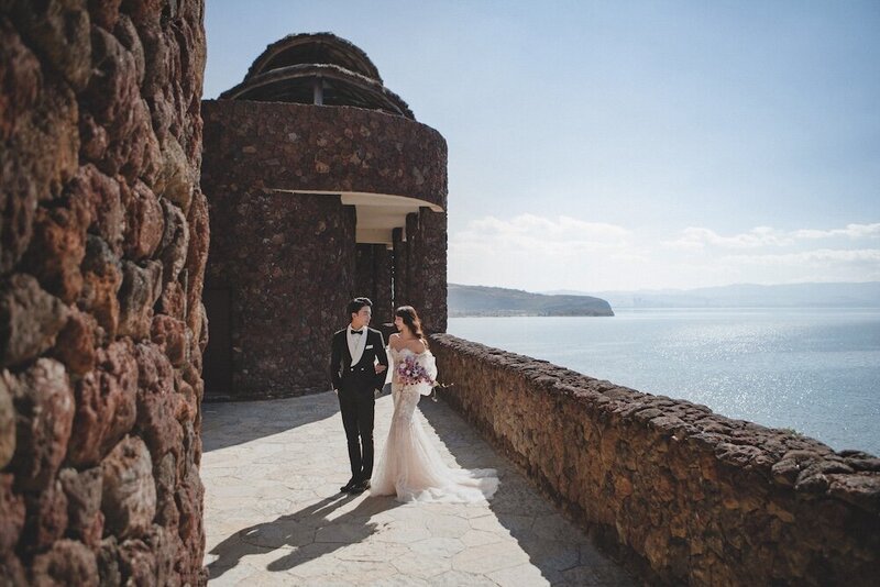 A beautiful bride and groom photographed on a beautiful coastline.