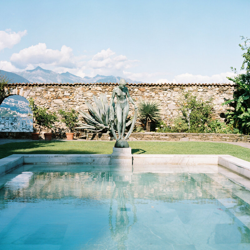 Stone statue by pool in Ticino