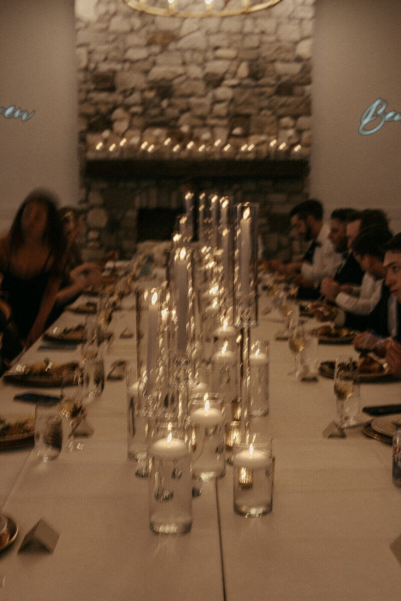 Candlelit wedding reception at harvest table