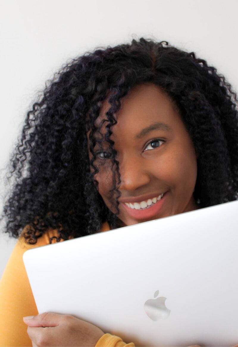 Kahja holding laptop