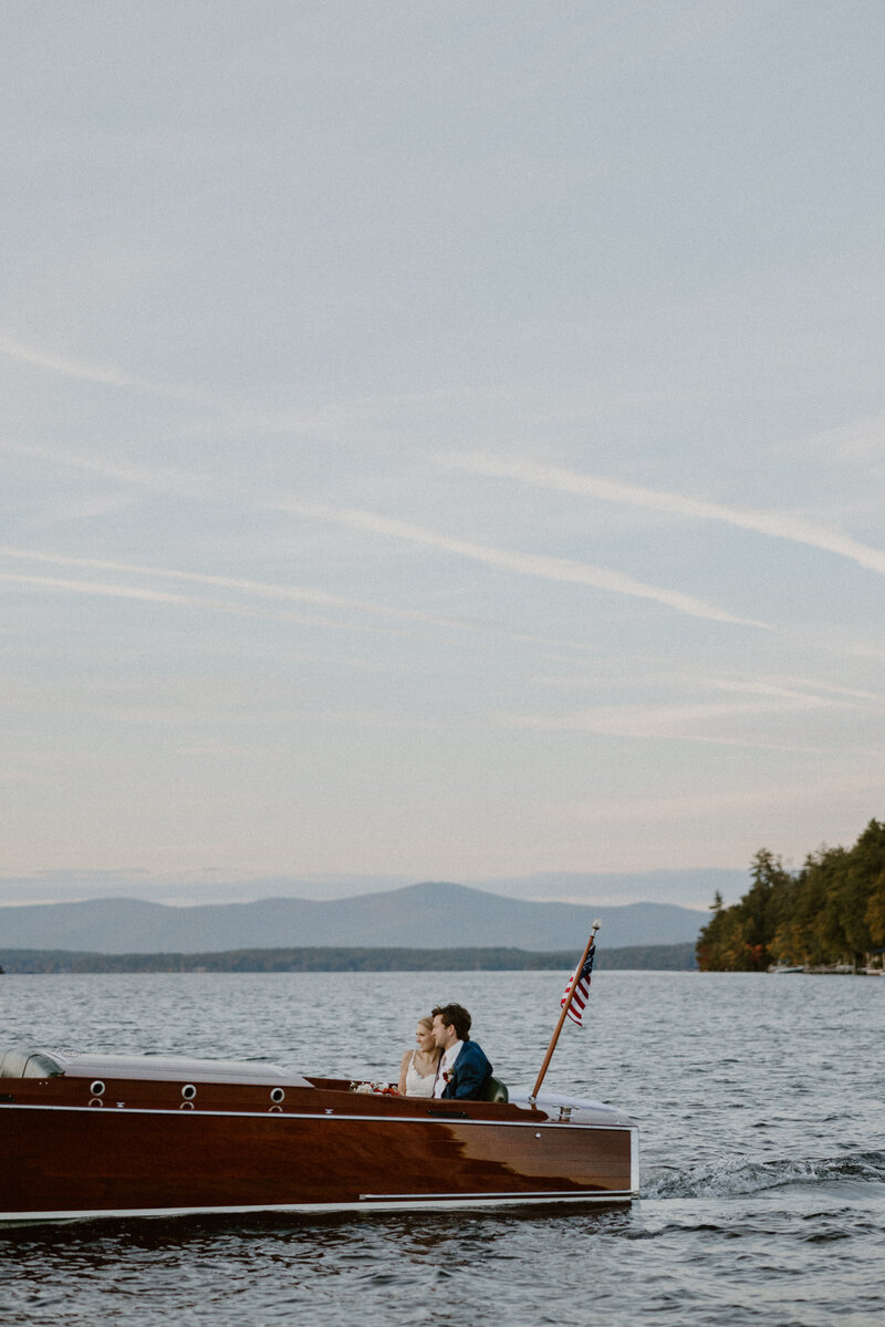 bride and groom on lake winnipesaukee