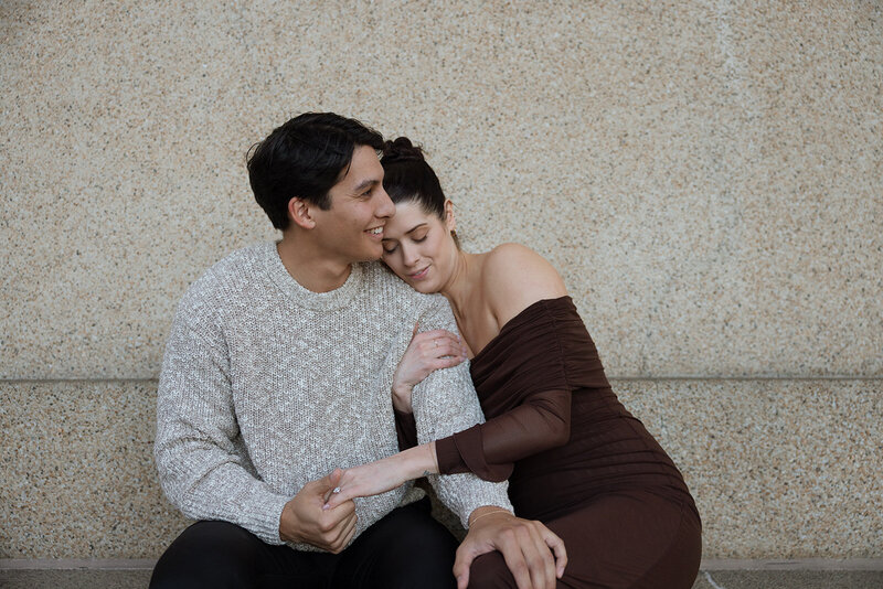 Couple embraces at The Parthenon in Nashville, TN after getting engaged. 