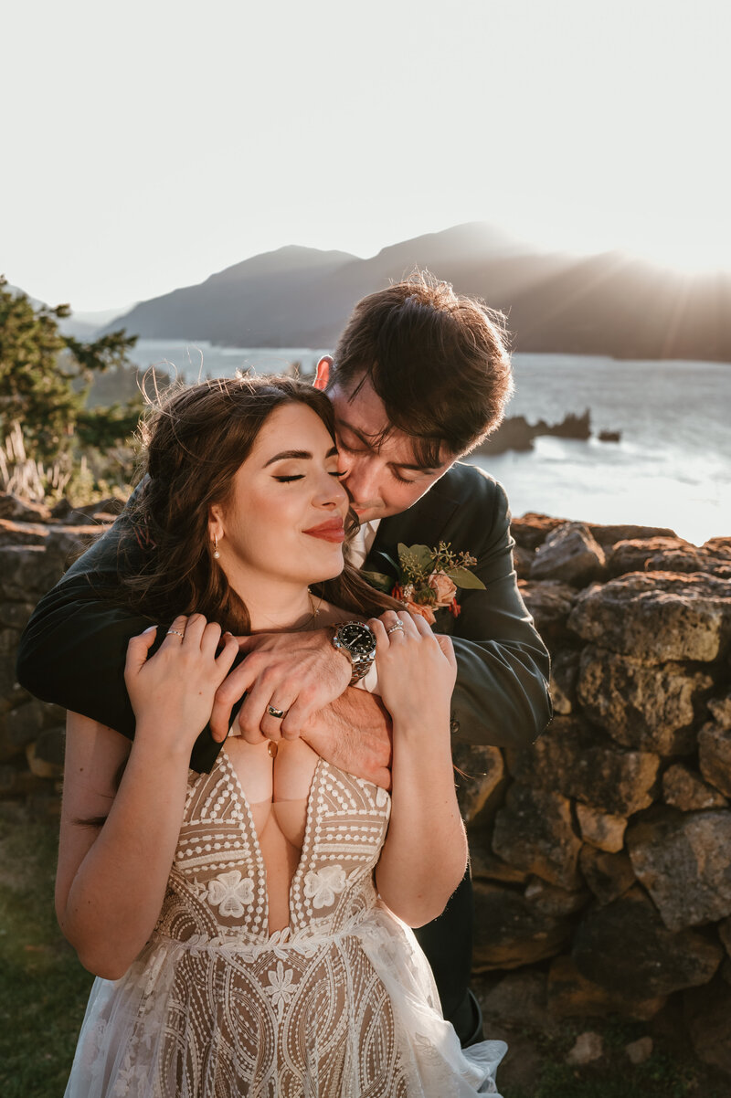 bride and groom hugging at the Griffin House in  Hood River