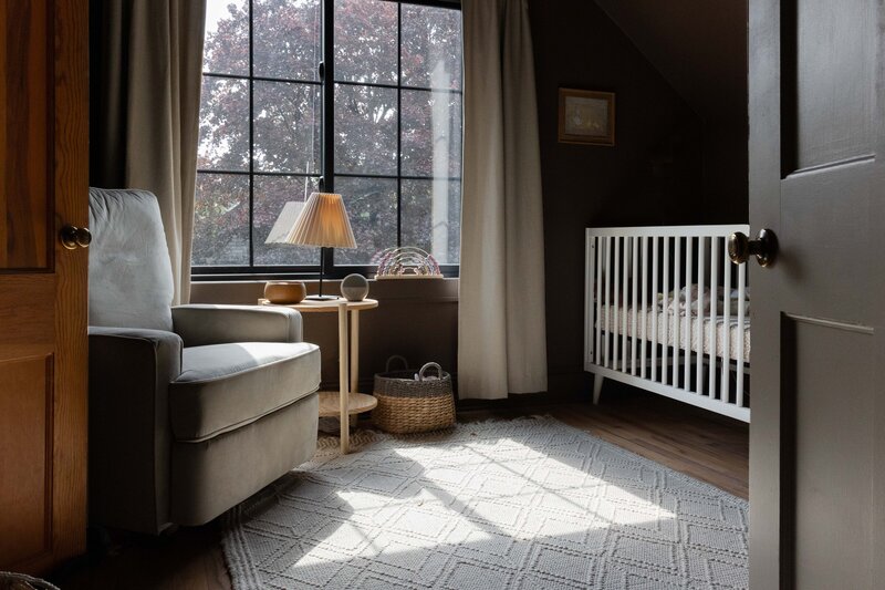 cozy rug and glider in childrens nursery