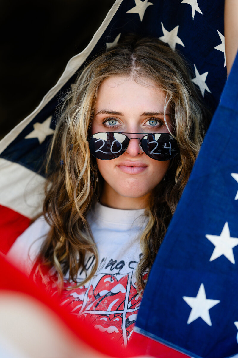 Senior picture photographers near me captures a girl drinking a glass bottle of vintage Dr. Pepper