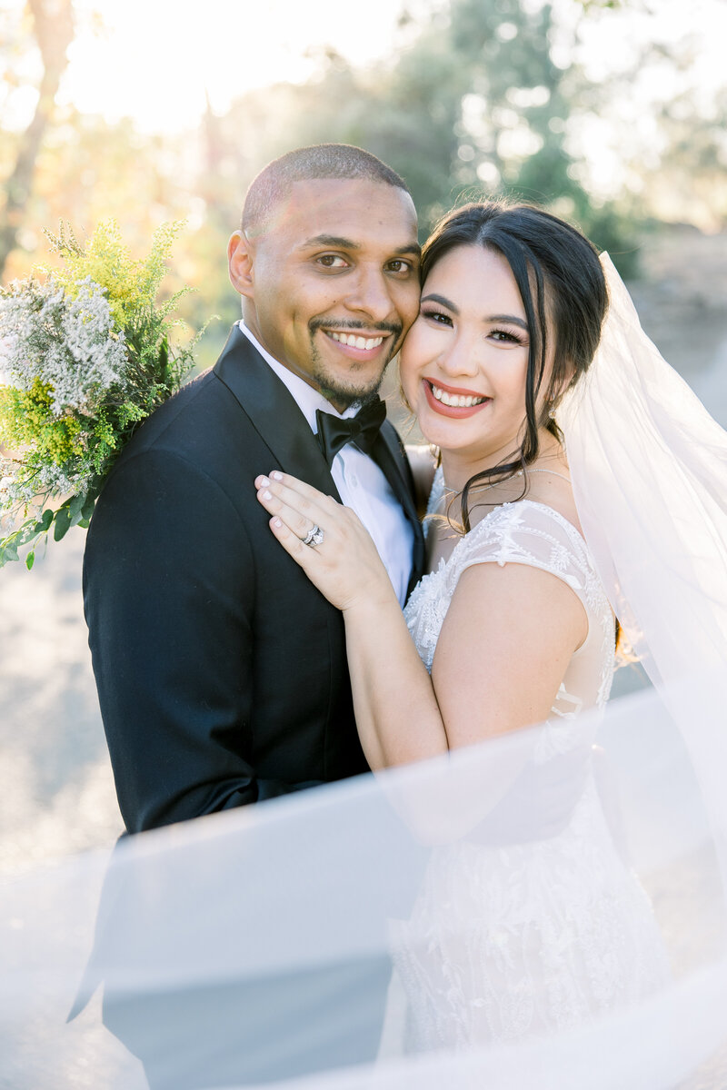 Bride + groom embrace at their Fresno elopement
