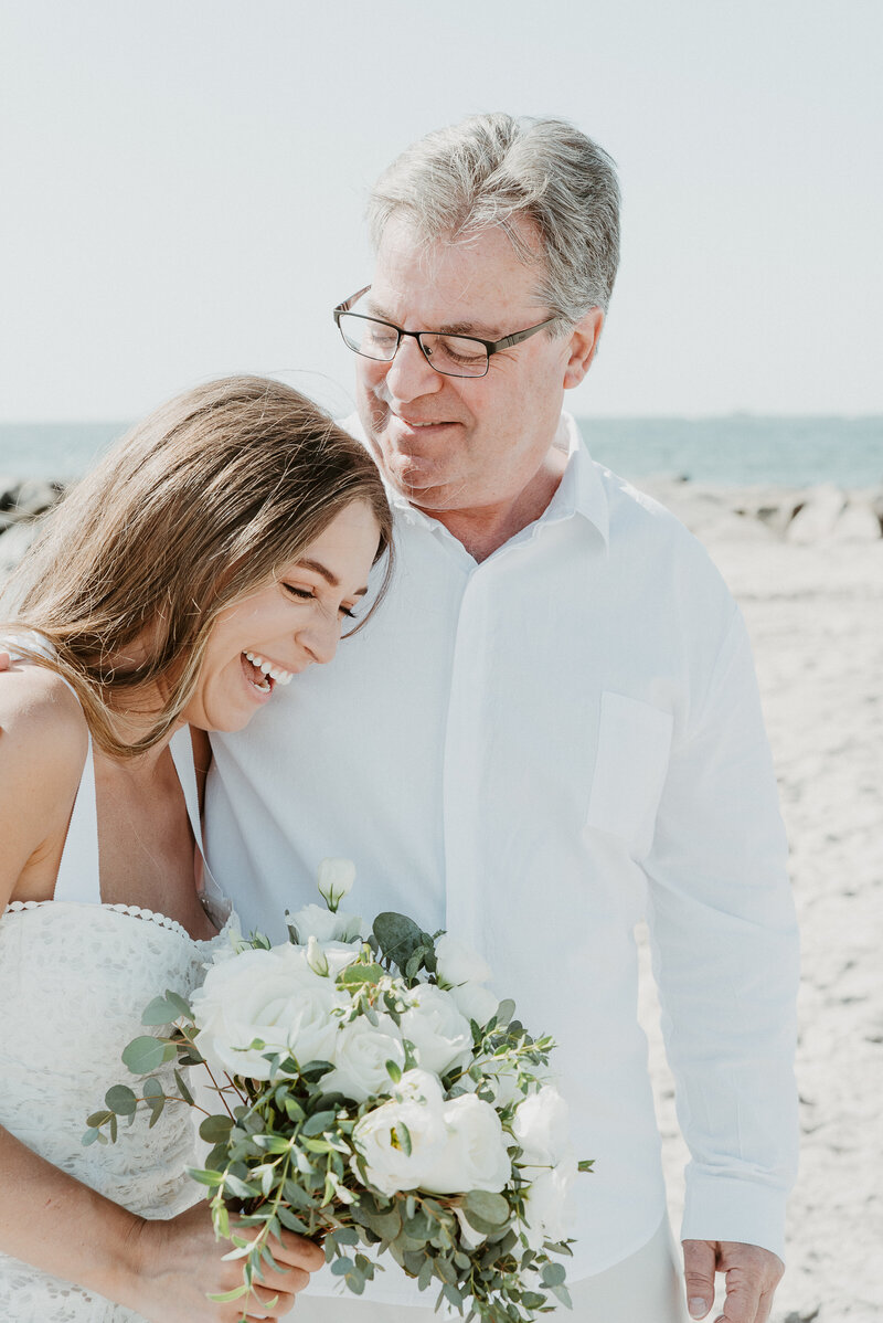 Bride and her dad smiling on beach at Santa Monica wedding