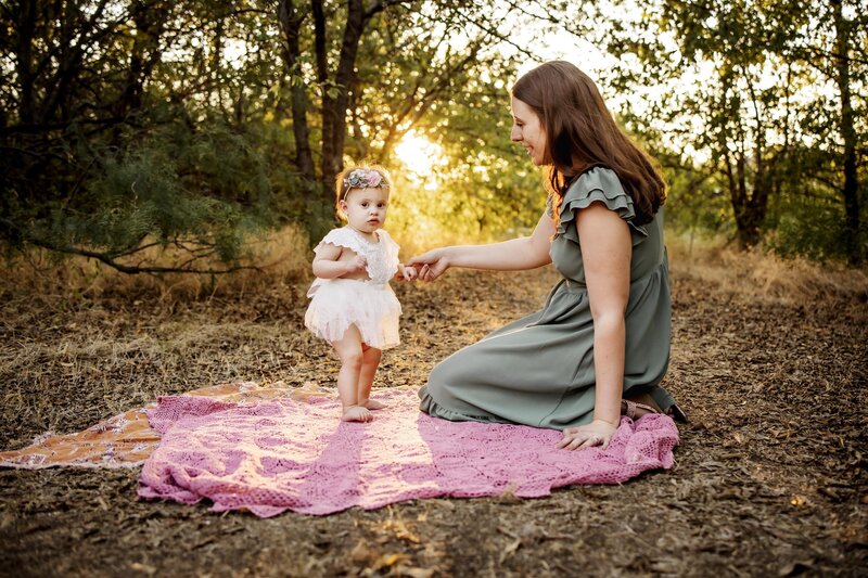 a one year old girl with her mom at a birthday session in carrollton texas