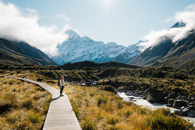 Washington elopement photographer hiking towards a mountain