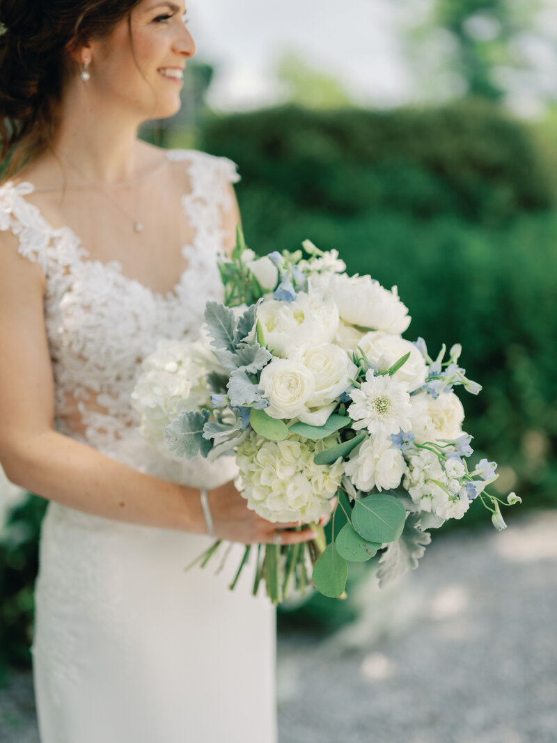 White badgley mischka Wedding Shoes with a Bridal bouquet with white florals and greenery.