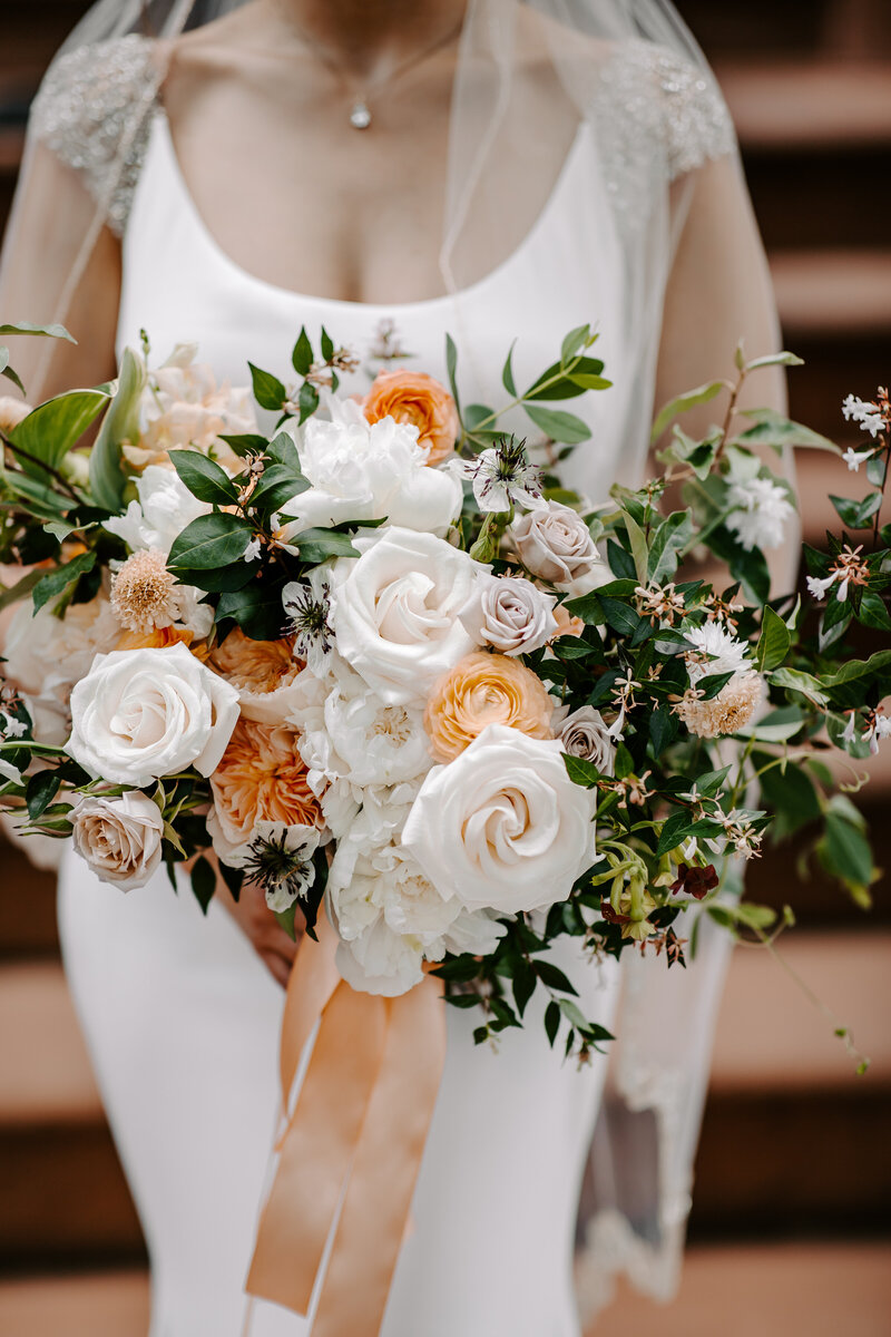 bride holding bouquet of flowers