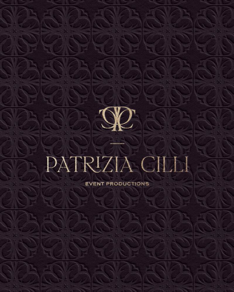 Embossed bespoke logo design for Patrizia Cilli on a deep purple patterned surface