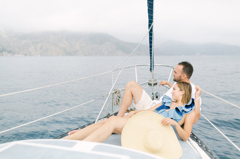Luxury wedding photographer engagement session on a sailboat