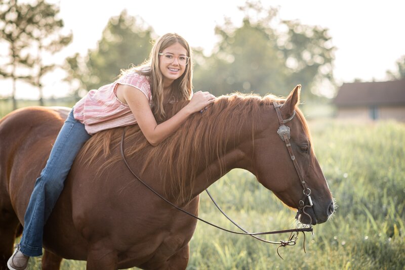 Young girl posing on horse bareback in Stillwater Okahoma