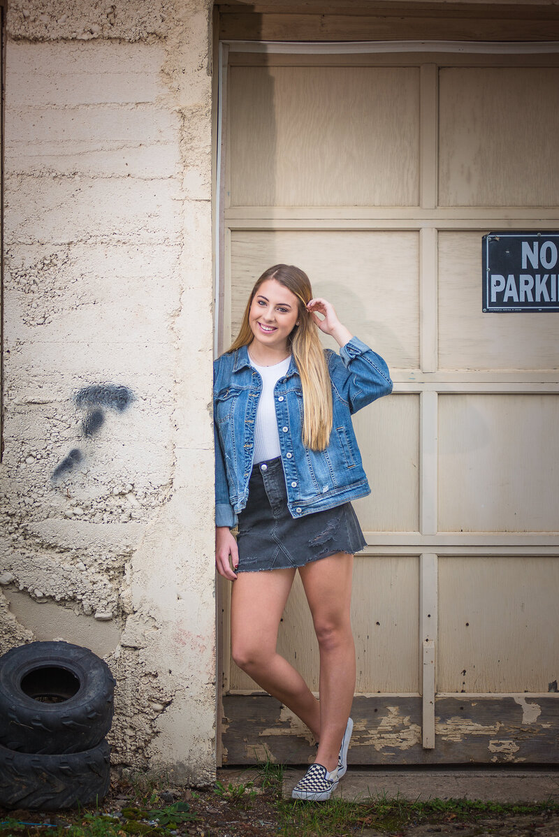 Teenage girl dressed in Denim Jacket and Skirt. Teen Portrait. Photo taken by Dripping Springs Texas based Lydia Teague Photography.