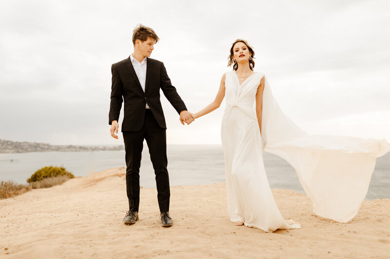 bride and groom at cliffside elopement in La Jolla