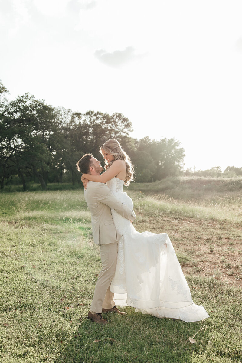 Groom dips bride for a kiss