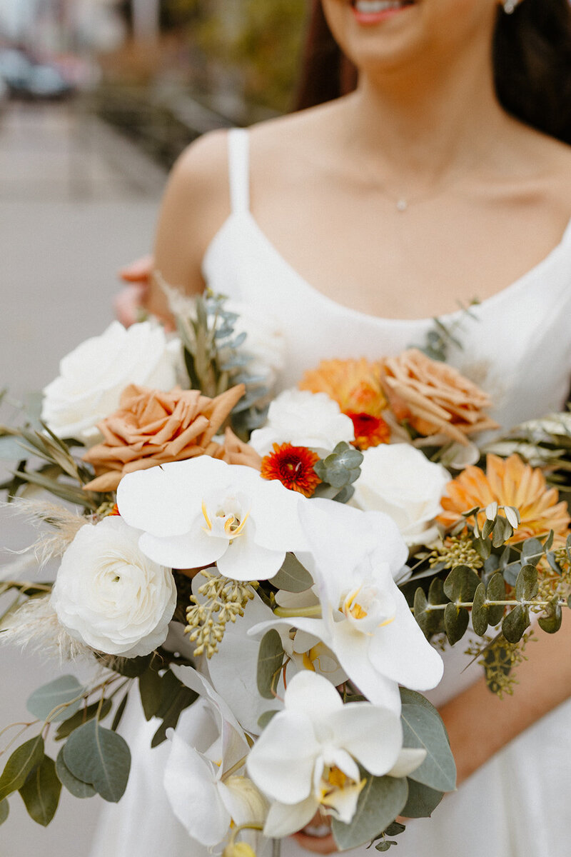 White and fall toned floral bridal bouquet