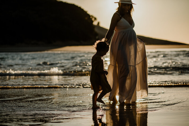 Brother and sister running through river | Family photo session