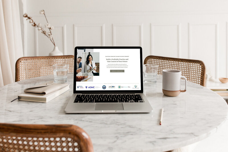 Laptop sitting on kitchen table with website for medical consultant