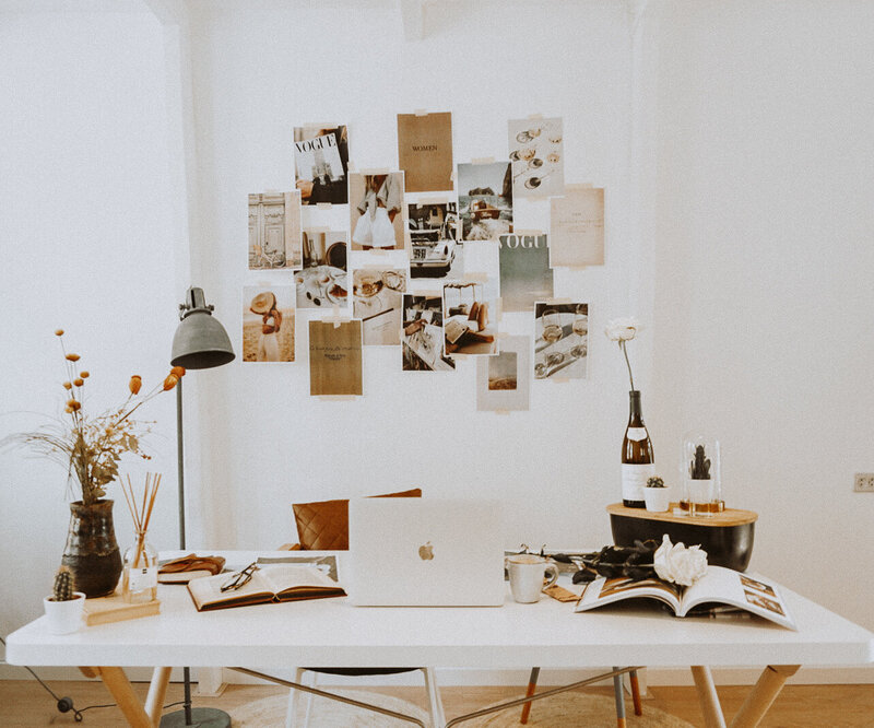 collage of pictures on a white desk