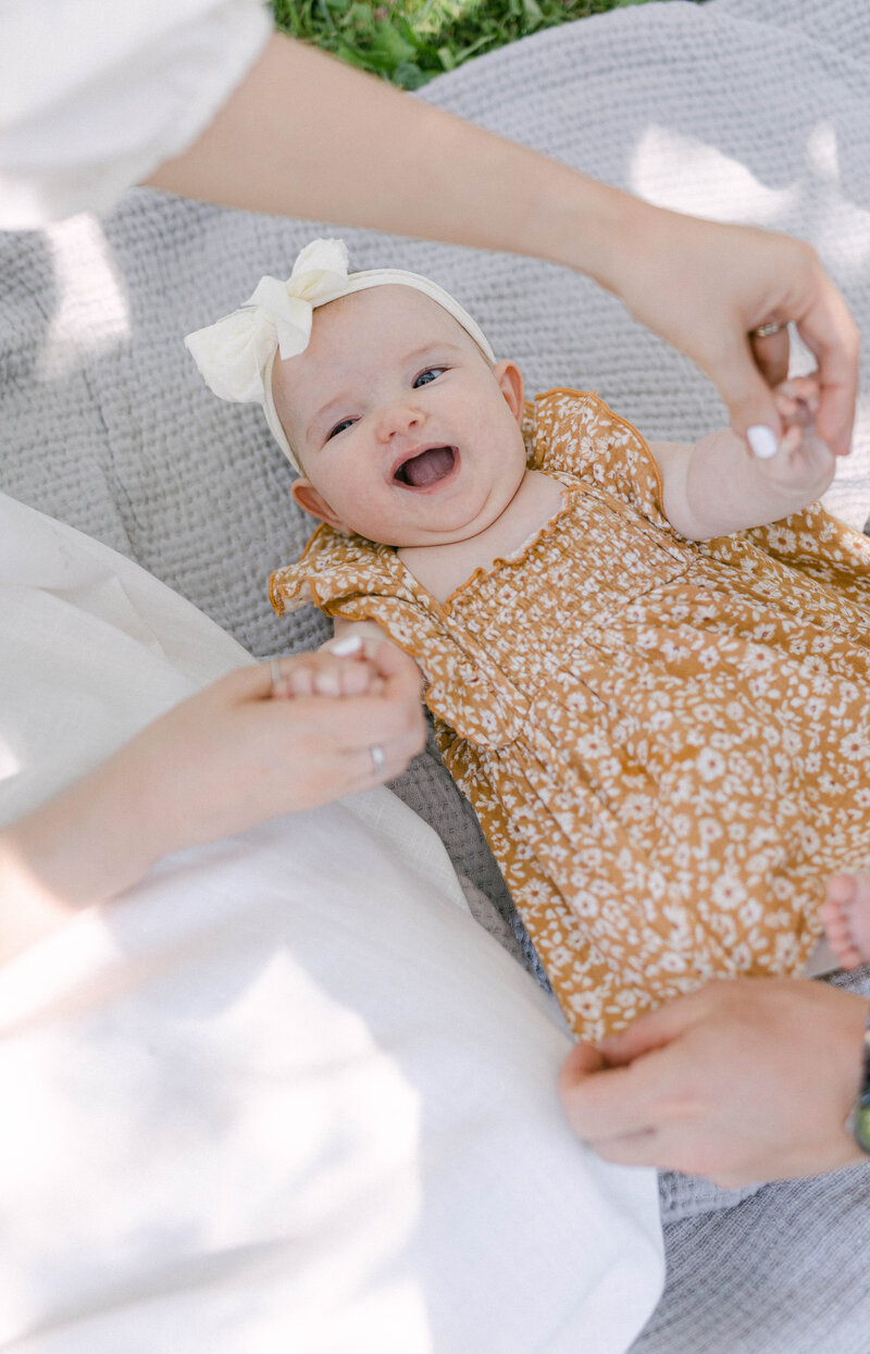 smiling 3 month old in basket knoxville tennessee newborn photographer