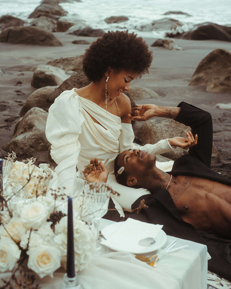 bride and groom on the beach at their destination wedding, elopement photography prices by elsie goodman