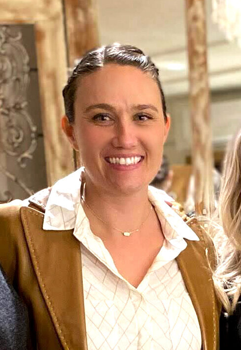 Two Nashville floral designers on a ladder working on a wedding ceremony feature