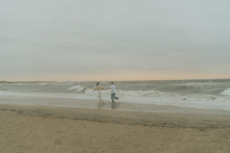 newly engaged couple beach engagement session