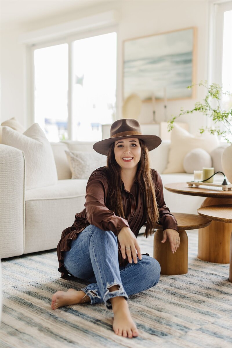 Designer sitting on white marble kitchen island