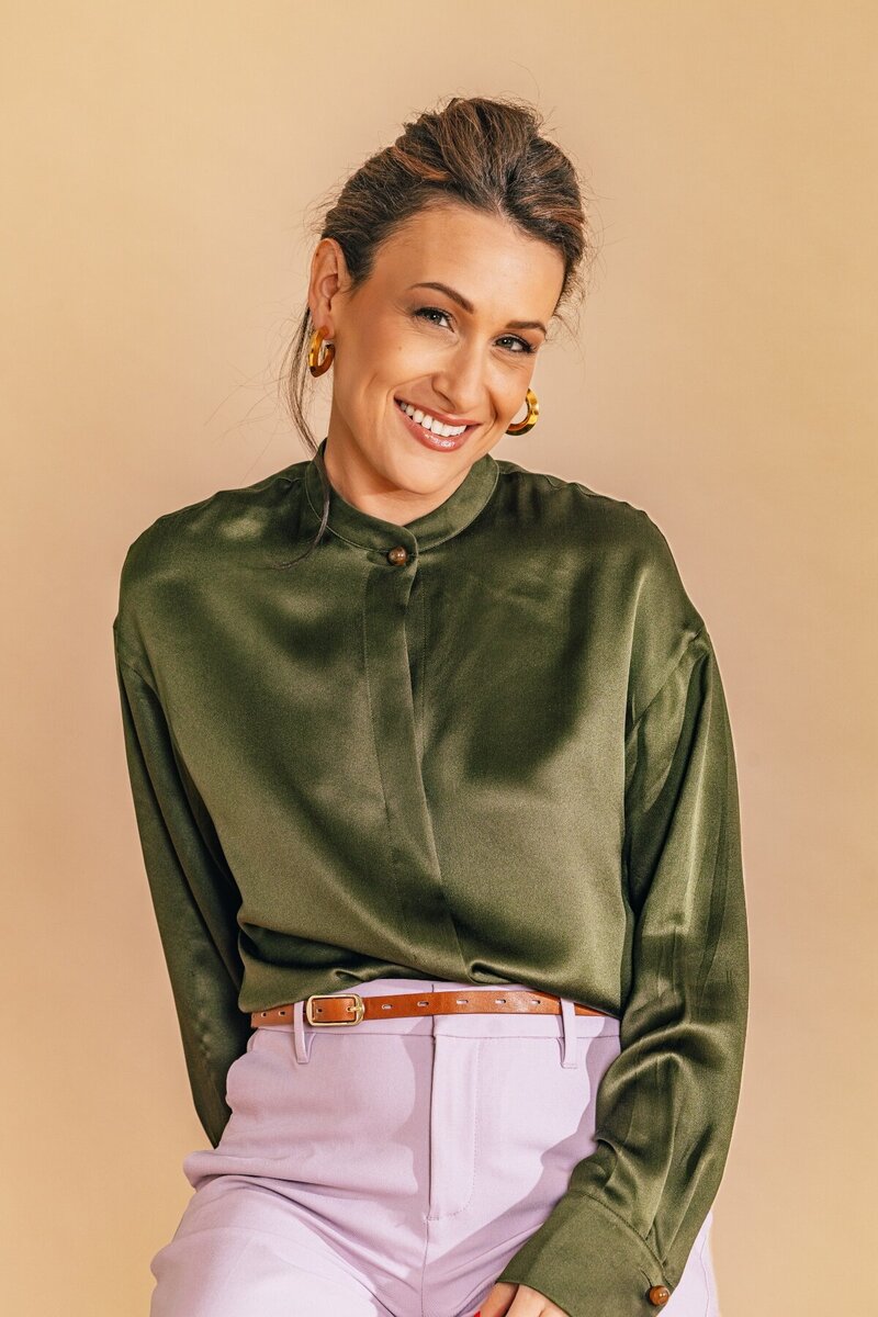 Julia Korn in Green Blouse Smiling