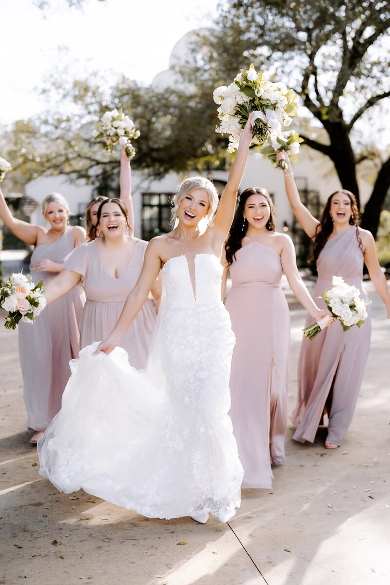 Joyful wedding party celebrating with the couple in Houston — captured by Julie & Daniel Photography