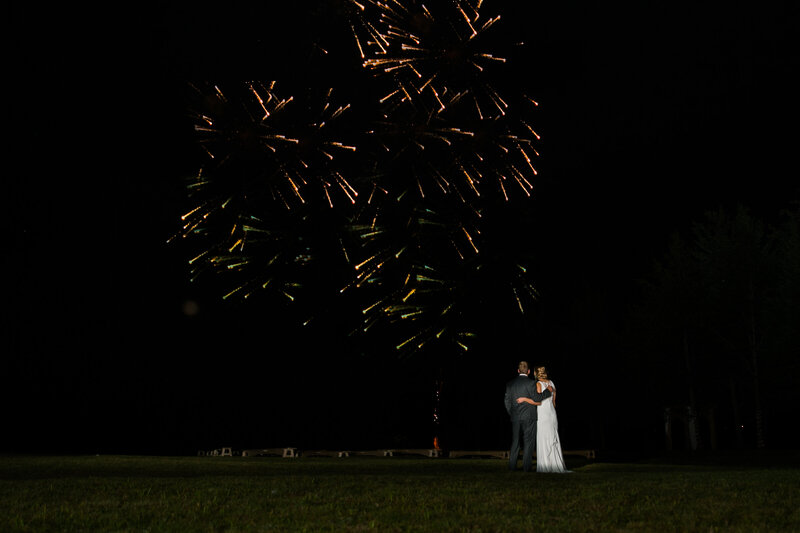 Bride and Groom watching fireworks | Klein Wedding at Grace on the Lake taken by Maine Wedding Photographer