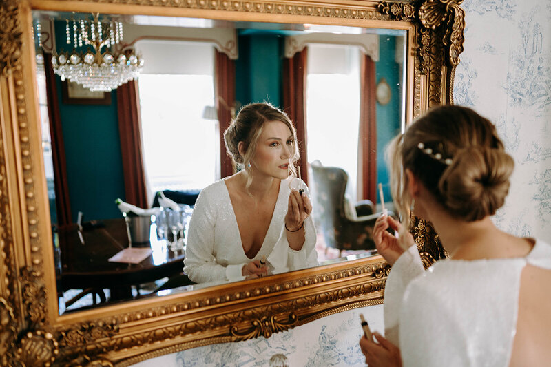 Julie the bride getting ready at the savoy in LOndon before her wedding