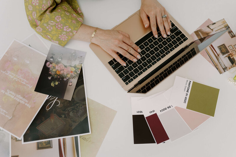 woman typing on a laptop next to images of flowers