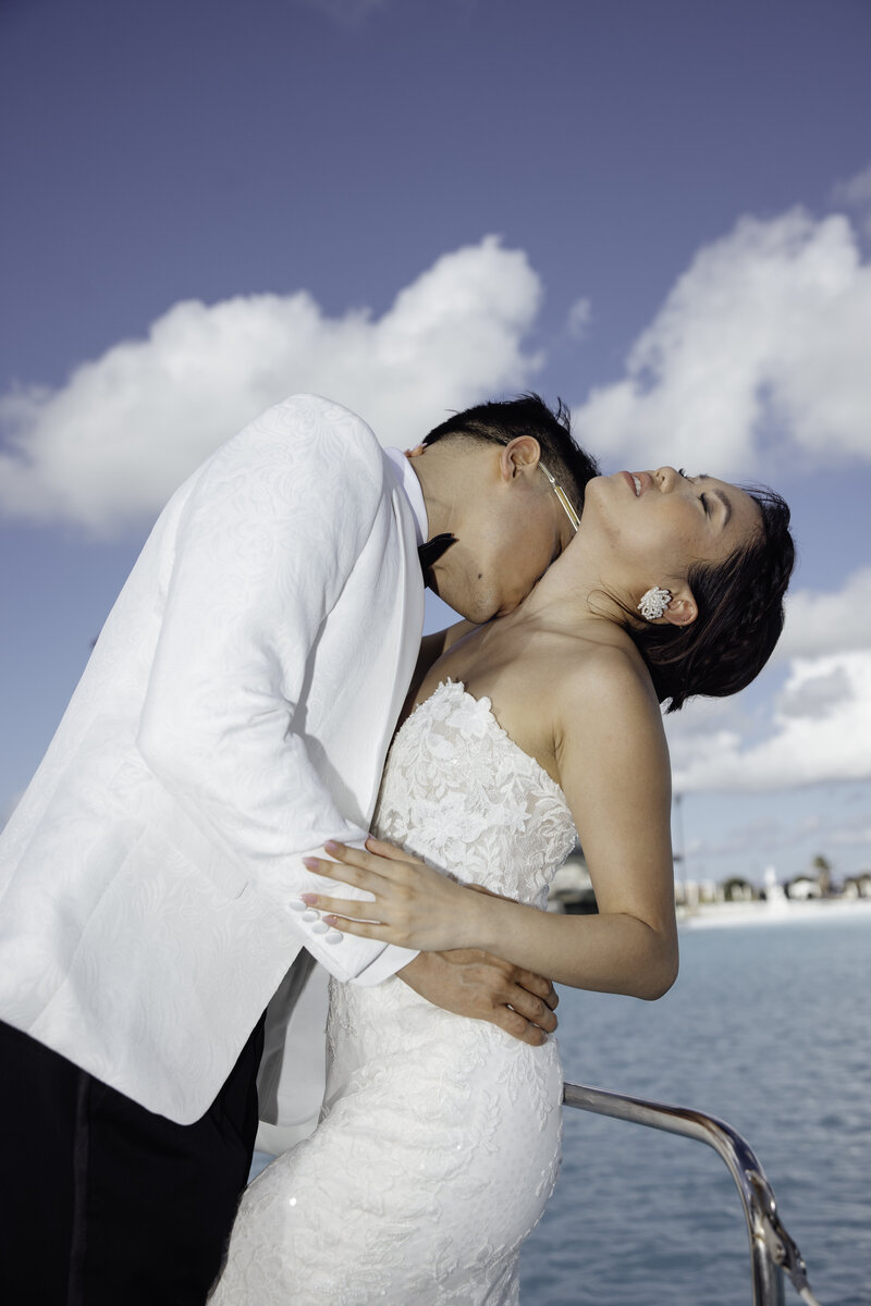 Couple riding on boat during their luxury destination wedding in Mexico.