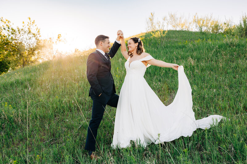Couple kissing at sunset for engagement photos