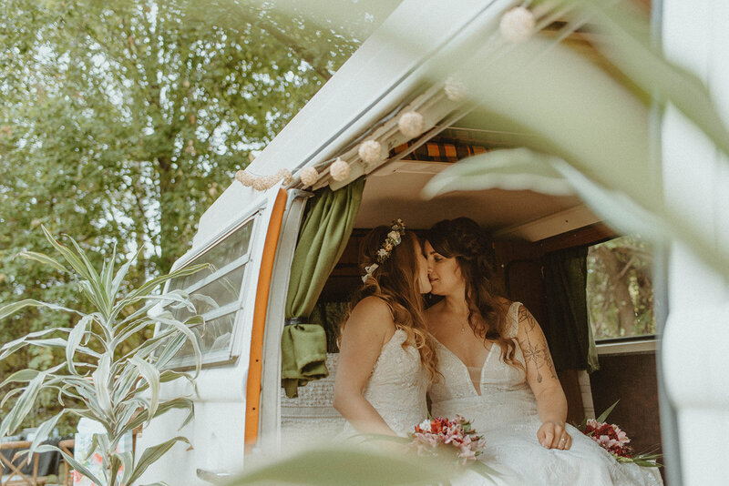 brides sitting in vw van