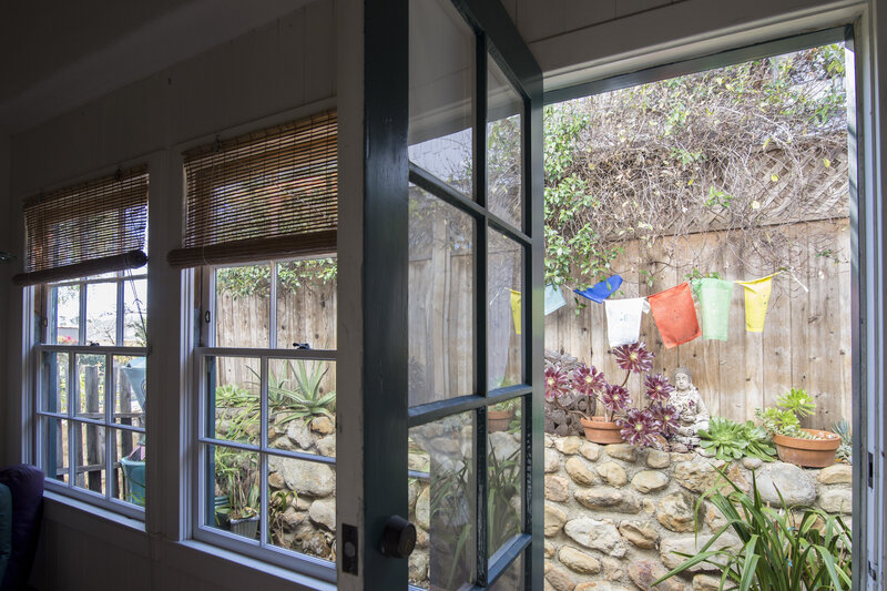 Open door leading to a peaceful patio, symbolizing reflection, self-discovery, and personal insight from the blog