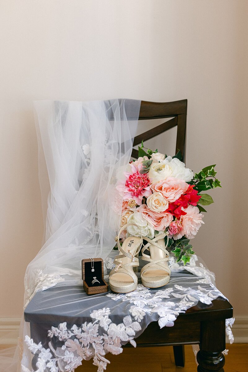 Wedding veil and bouquet on chair