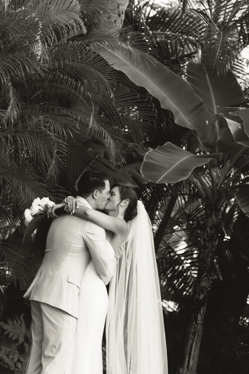 Traditional Hawaiian officiant blessing the couple with conch shell