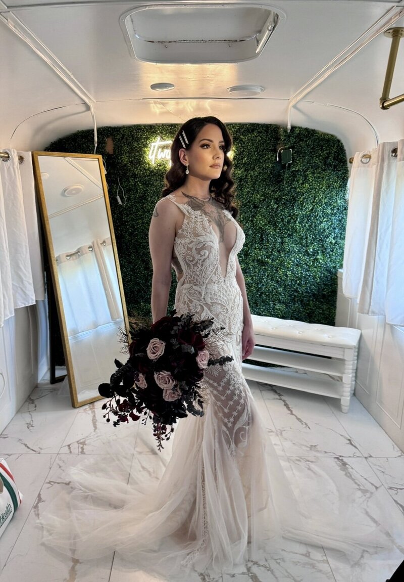 Bride posing inside a vintage bridal suite, showcasing Blushed Miami’s luxury bridal beauty services.